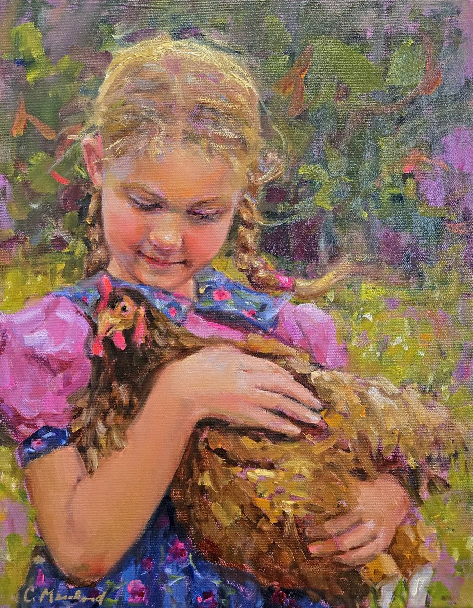 girl holding a chicken